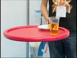 Companies present robots which make pancakes, serve drinks News Clip