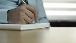 Slider Shot: Close Up of Businessman Handwriting Stock Footage