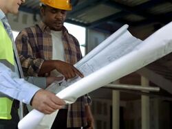 HD DOLLY: Construction Engineer And Foreman Examining Blueprints Stock Footage