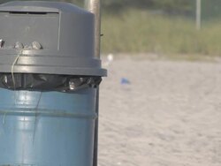 Trash can at the beach Stock Footage