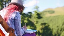 Young woman painting landscape in open air Stock Footage