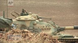 Intensified US-led airstrikes and a determined Kurdish military force on the ground appeared to have had some success in halting advances by Islamic State fighters on a strategic Kurdish town near Syria's border with Turkey. (Oct. 16) News Clip