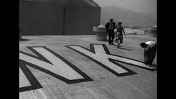 Will Rogers, Jr. and Virginia Gibson examine sky marker atop Warner Bros. sound stages News Clip