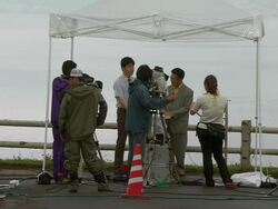MS Shot of television news crews preparating for G8 meeting / Hokkaido Toyako, Japan Stock Footage