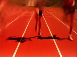 CU T/L athletes feet running down track, Australia Stock Footage