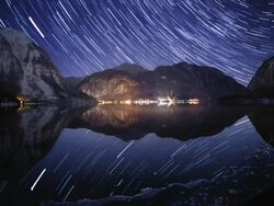Night sky and star trails above Hallstatt Stock Footage