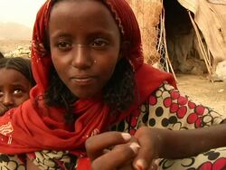 Children looking at the camera and then reacting to their image on it Stock Footage
