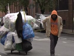 Man collecting tin cans, New York City, USA Stock Footage