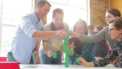 Business people stacking green blocks Stock Footage