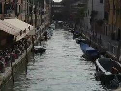 WS LD Canal with Moored Boats / Venice, Italy Stock Footage