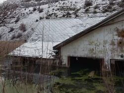 Wide panning shot of flooded house / Thistle, United States Stock Footage