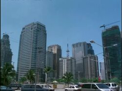 Modern high-rise city buildings and traffic, Ortigas Commercial Centre, Manila, Philippines Stock Footage