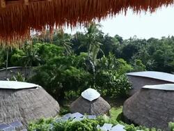 WS TD HA Shot of large group of solar panels around huts / Ubud, Bali, Indonesia Stock Footage