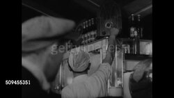 1936: U.S. PRESIDENTIAL CAMPAIGN OVER RADIO: VS People sitting on porch listening to radio, diner waiter turning up radio, men gathered at diner bar listening, taxicab drivers gathered around car radio, family in living room listening. (SOT) Instructional Video
