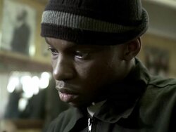 CU R/F Barber using clippers shaving customer's facial hair at Barbershop, Brooklyn, New York City, New York State, USA Stock Footage