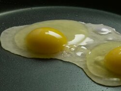 CU, Two eggs frying on pan, Atlanta, Georgia, USA Stock Footage