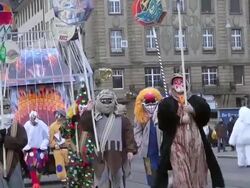 MS Shot of masked people walking on street and celebrating in Basel Carnival (Basler Fasnacht) / Basel, Switzerland Stock Footage