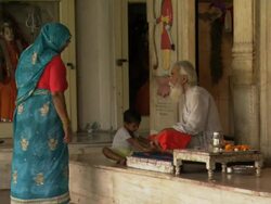 WS Senior man talking with woman and child in temple / Amritsar, Punjab, India Stock Footage