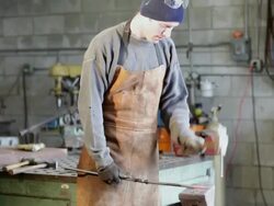 MS TU TD Metalsmith working in his studio / Santa Fe, New Mexico, United States    Stock Footage
