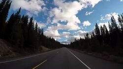 Car driving on Icefields parkway scenic road Stock Footage