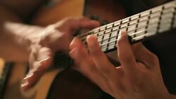Acoustic guitar in musician hands Stock Footage