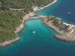 MS AERIAL Shot of islands near piraeus with sailboat / Piraeus, Peloponnese, Greece Stock Footage