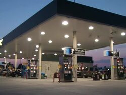 Medium Long Shot static - LED lamps illuminate a gas station /  Wisconsin, United States Stock Footage