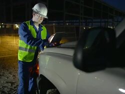 Engineer or job superintendent uses a tablet on construction site Stock Footage