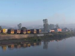  WS Trucks parking near by river / Punjab, India Stock Footage