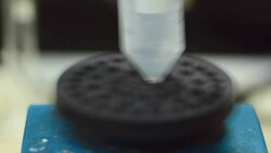 stir white liquid in plastic centrifuge tubes Stock Footage