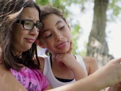 Best Friends Making Silly Faces at Smart Phone Clip 1 Stock Footage