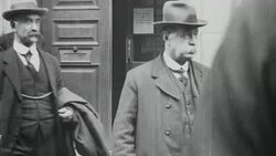 1921 WS Government and Miners' Federation team members exit the Board of Trade building after negotiations / United Kingdom Stock Footage