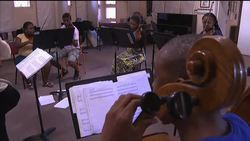 Charity teaching impoverished township children classical music News Clip