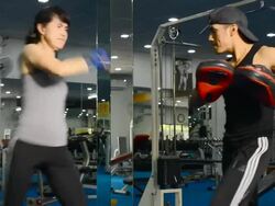 Lady doing Muay Thai (Kickboxing) exercise. Stock Footage