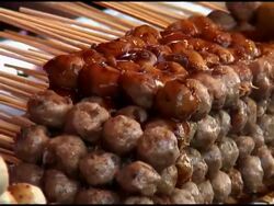 Food Preparation: Pouring Sauce On Wontons /Dumplings Stock Footage
