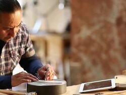 Native American artist using digital tablet in his art studio Stock Footage