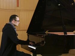 Asian man play piano Stock Footage