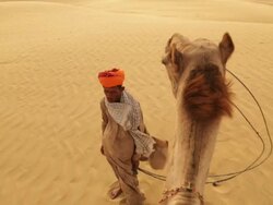 Rajasthani man standing on desert, Sam Desert, Jaisalmer, Rajasthan, India Stock Footage