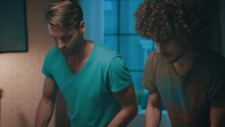 Guys playing tabletop soccer in apartment Stock Footage