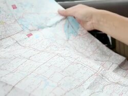 Close up of person tracing a route on a map with their finger Stock Footage