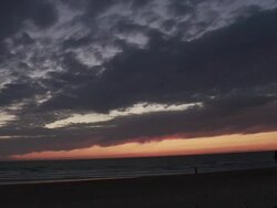 MS Young man doing somersault on beach after sunset / Cap de l'Homy, Aquitaine, France Stock Footage