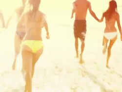 young adults on the beach Stock Footage