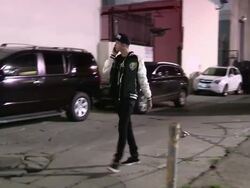 T Mills greets fans while on Phone in Hollywood at Stock Footage