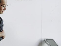 MS PAN TU two designers in high tech office discussing project Stock Footage