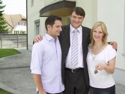 HD CRANE: Realtor Posing With New Homeowners Stock Footage