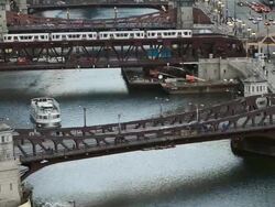 WS HA View of river and wacker drive showing rail, boat, motor vehicle traffic / Chicago, Illinois, United States Stock Footage