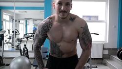 Man posing in the gym. Slow motion. Stock Footage