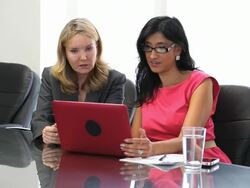 Businesswomen in conference room Stock Footage