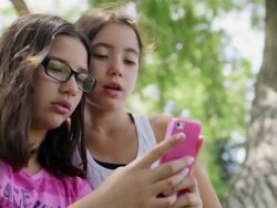 Best Friends Making Silly Faces at Smart Phone Clip 2 Stock Footage