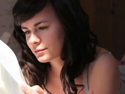 Female reading book in bedroom Stock Footage